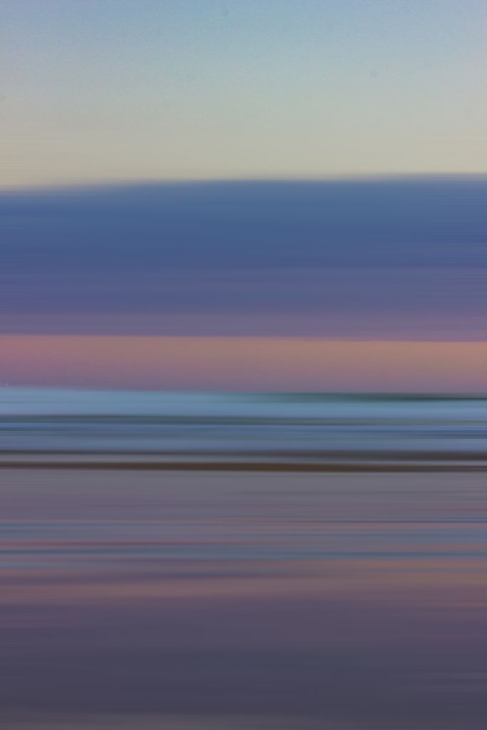 A serene abstract seascape capturing the tranquil blend of colors at dawn, evoking peace.